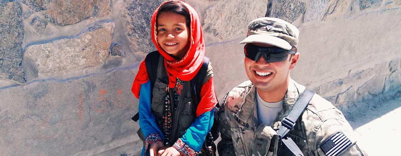 Ankit Pandav pictured in uniform with Afghan girl