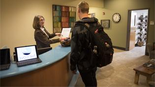Picture of conversation at cove front desk